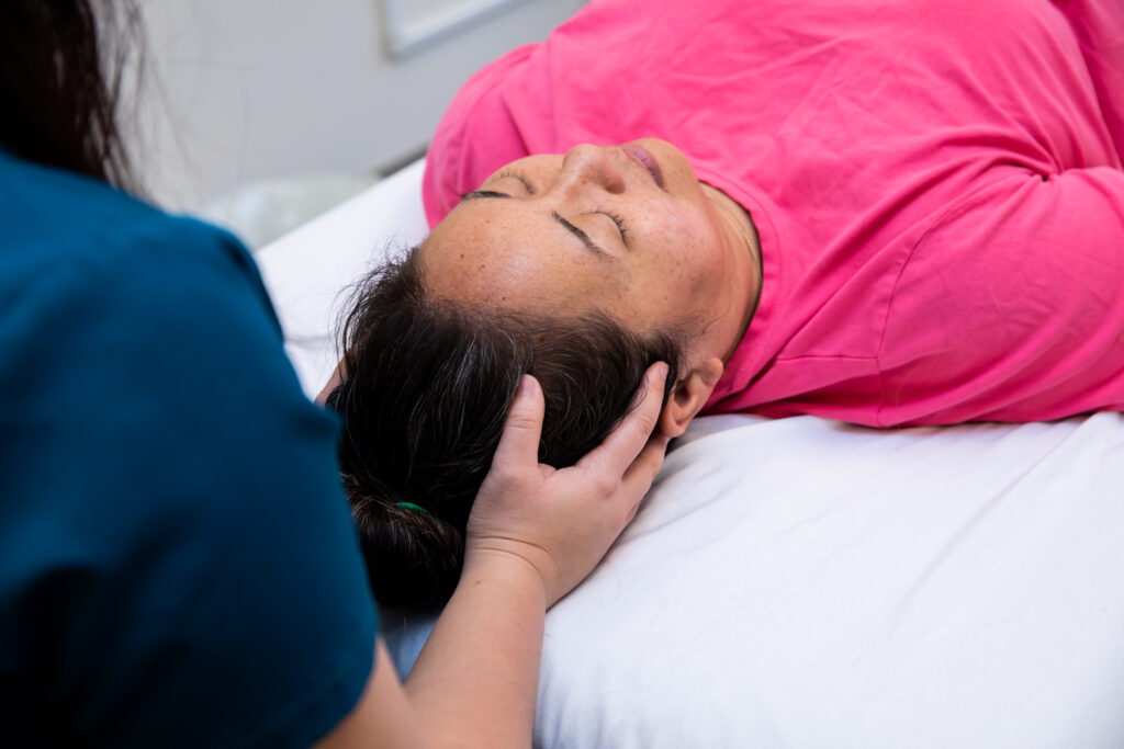 photo of provider cradling patient's head