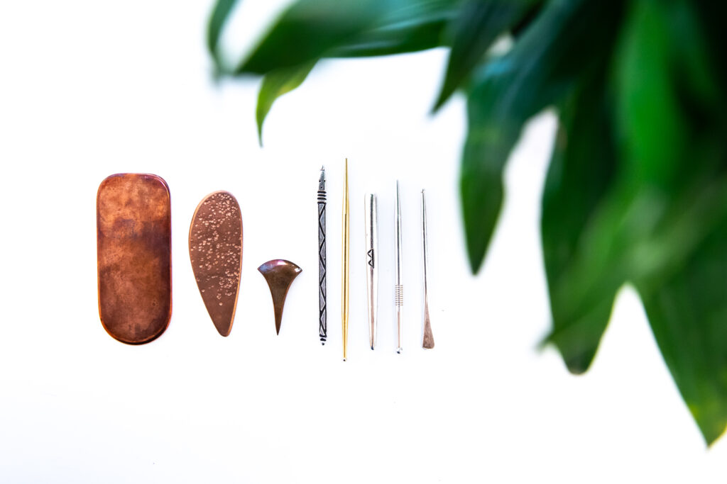 Various metal non-insertive tools in varying shapes and sizes on a white background.