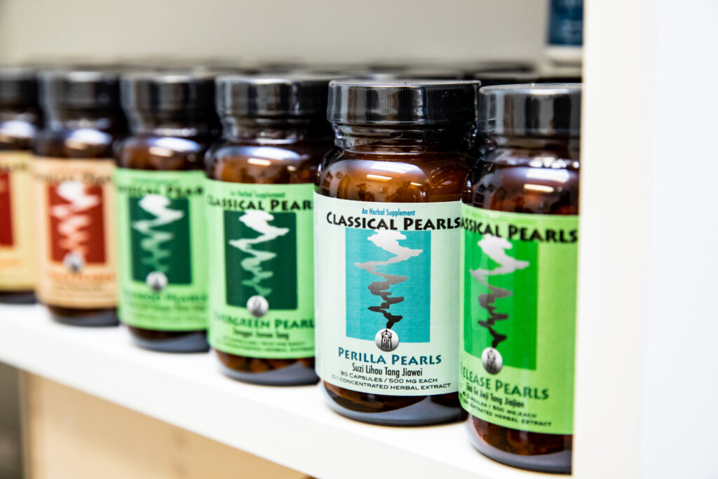 Lined bottles of Classical Pearls herbal supplements